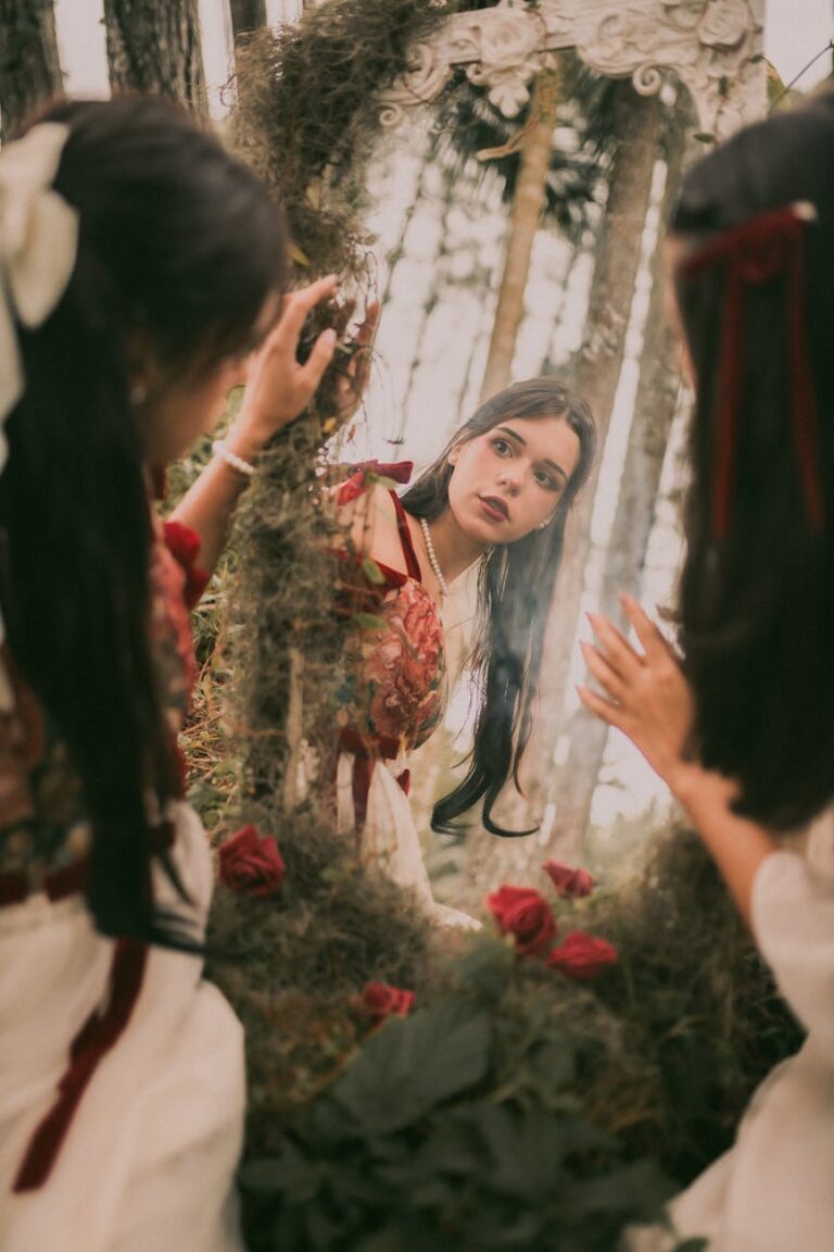 young women looking in the mirror in a forest